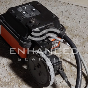 close up image of a small GPR antenna laying on the ground